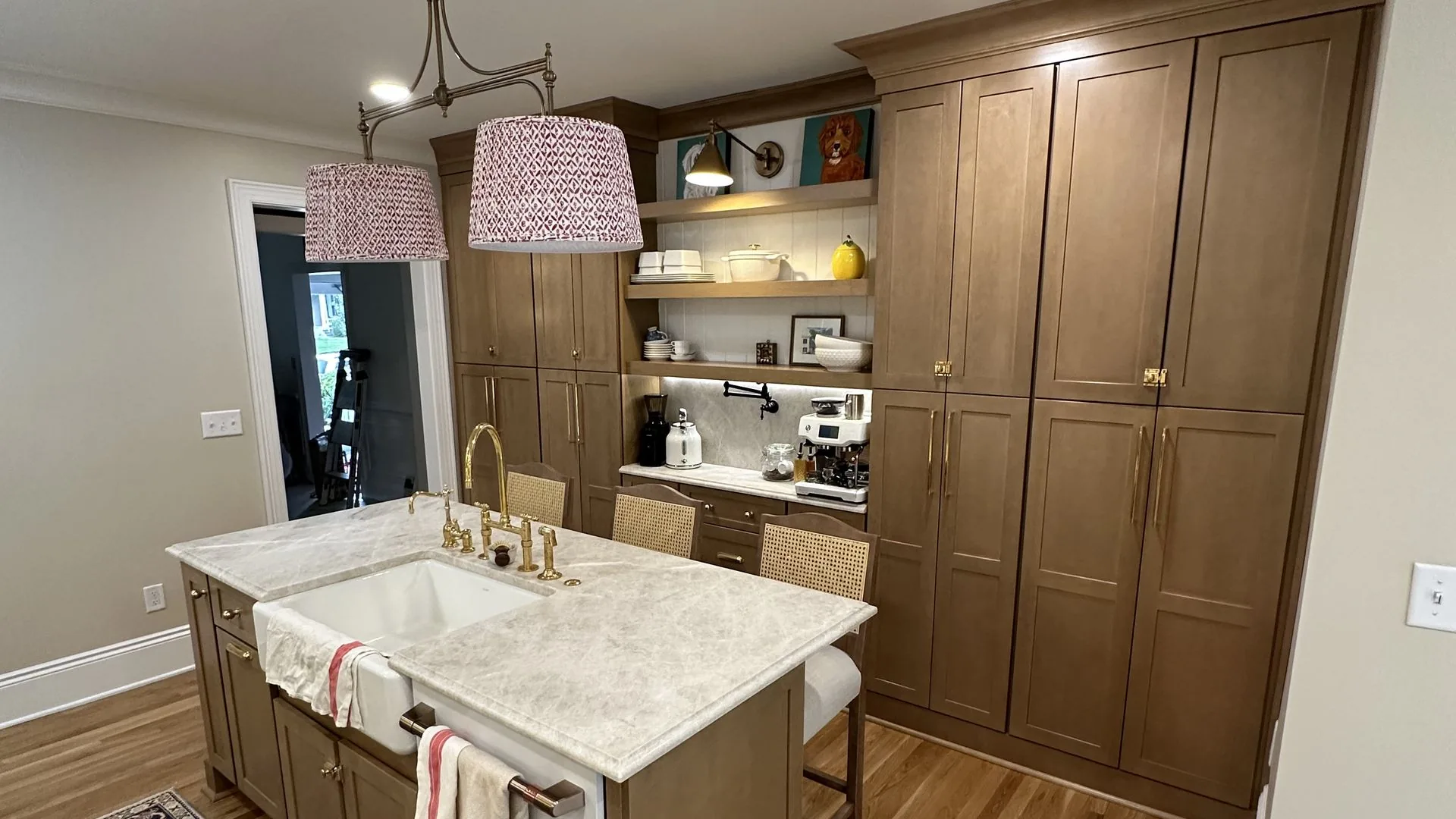Remodeled kitchen with warm wood cabinetry and woven pendant lighting. 42nd Street, Richmond, VA