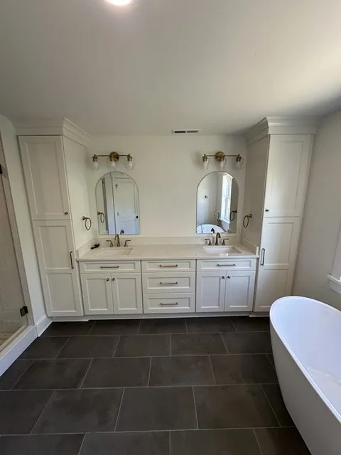 Remodeled primary bathroom with double vanity and freestanding tub. Addison Creek, Richmond, VA