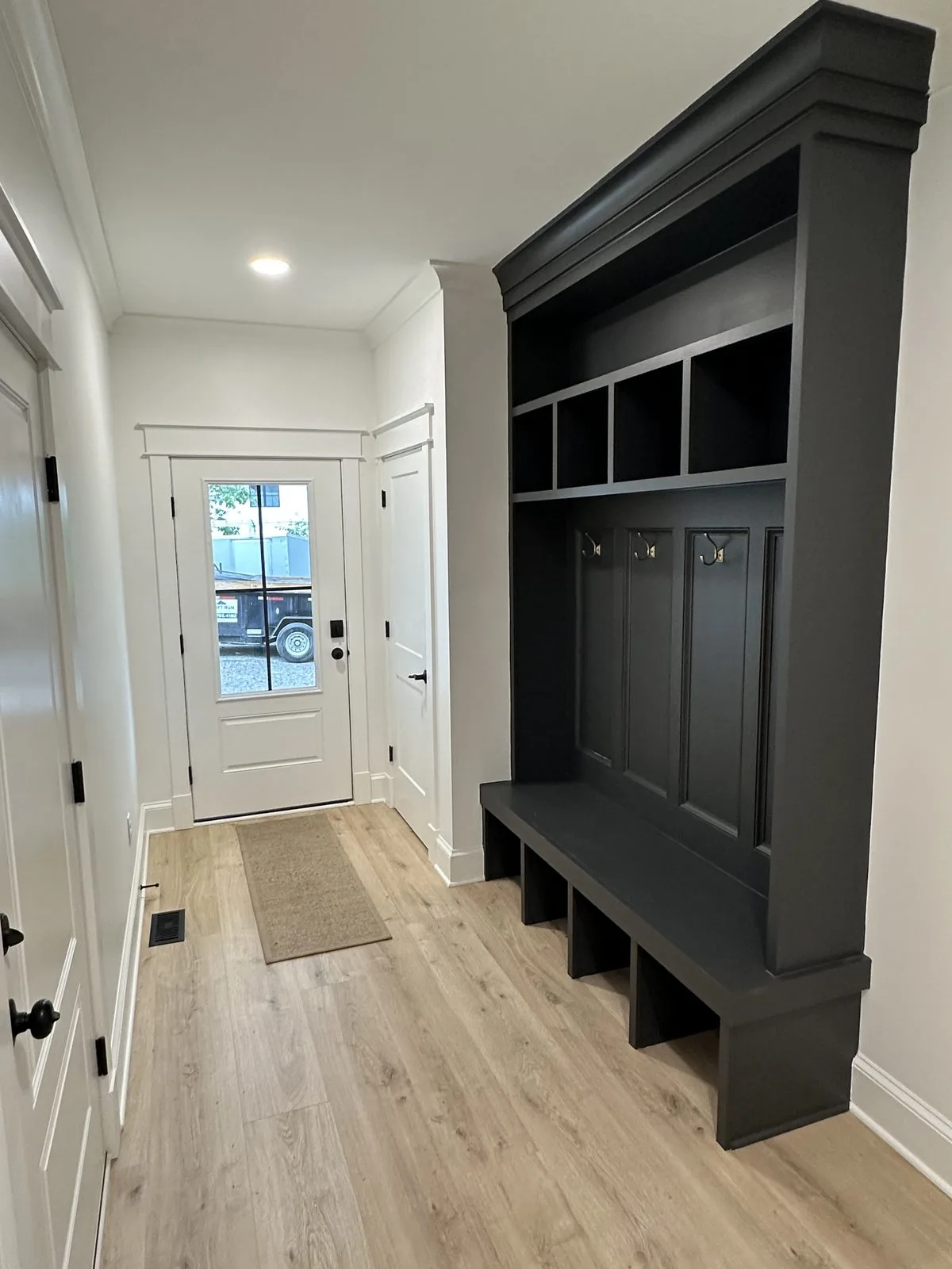 Custom-built entryway storage crafted by Swift Run Renovations in Richmond, VA