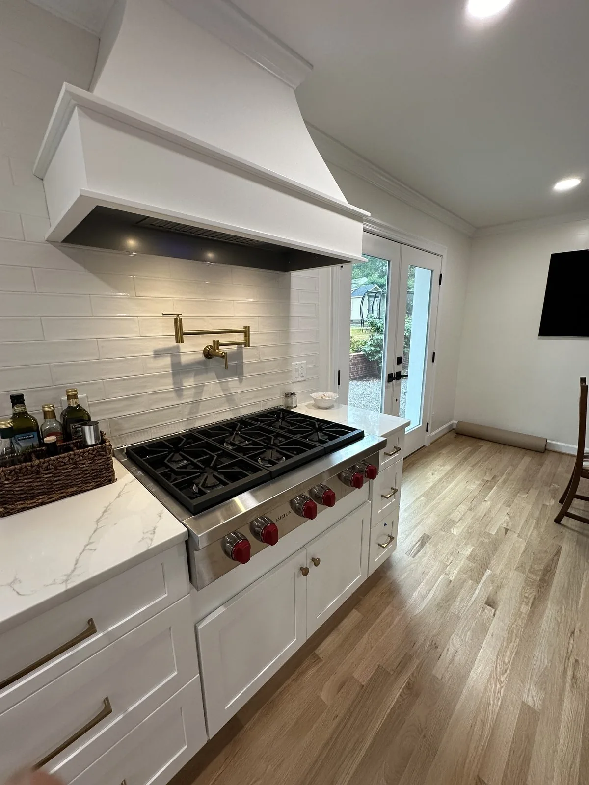 Professional range and custom hood in a remodeled kitchen. Baldwin Road, Richmond, VA