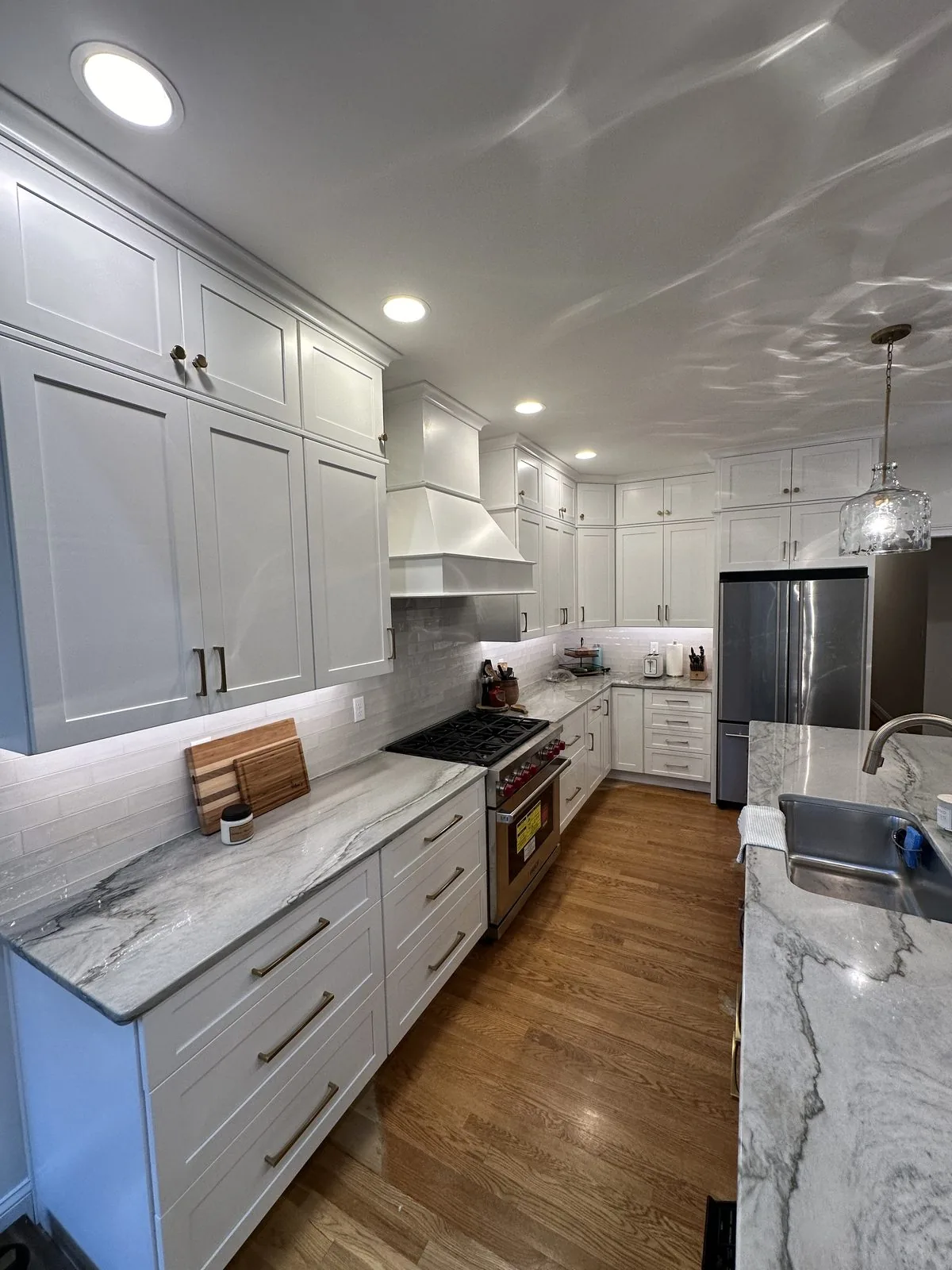 Remodeled kitchen with marble island and custom cabinetry. Brook Road, Richmond, VA