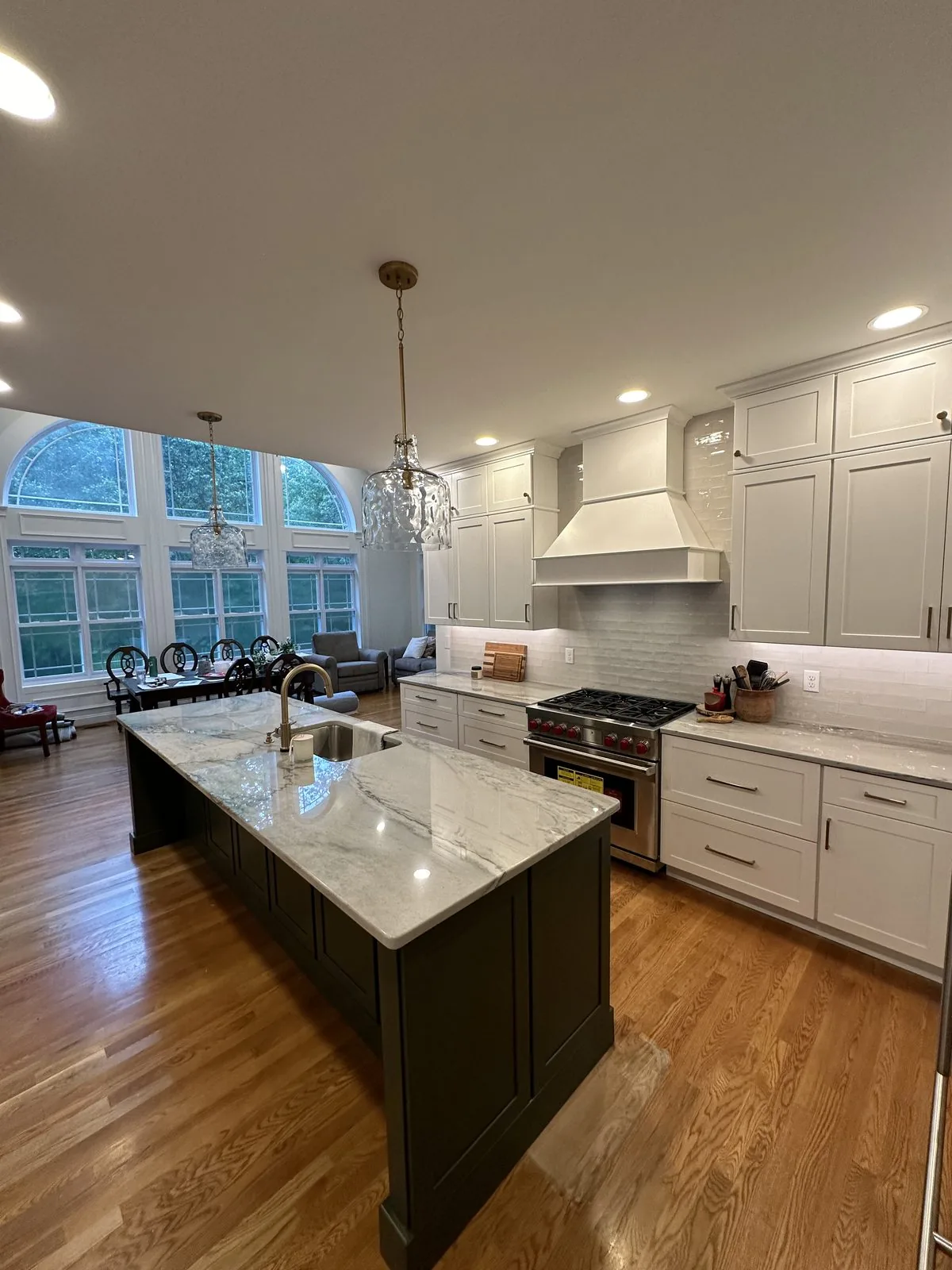 Kitchen island with seating and glass pendant lighting. Brook Road, Richmond, VA