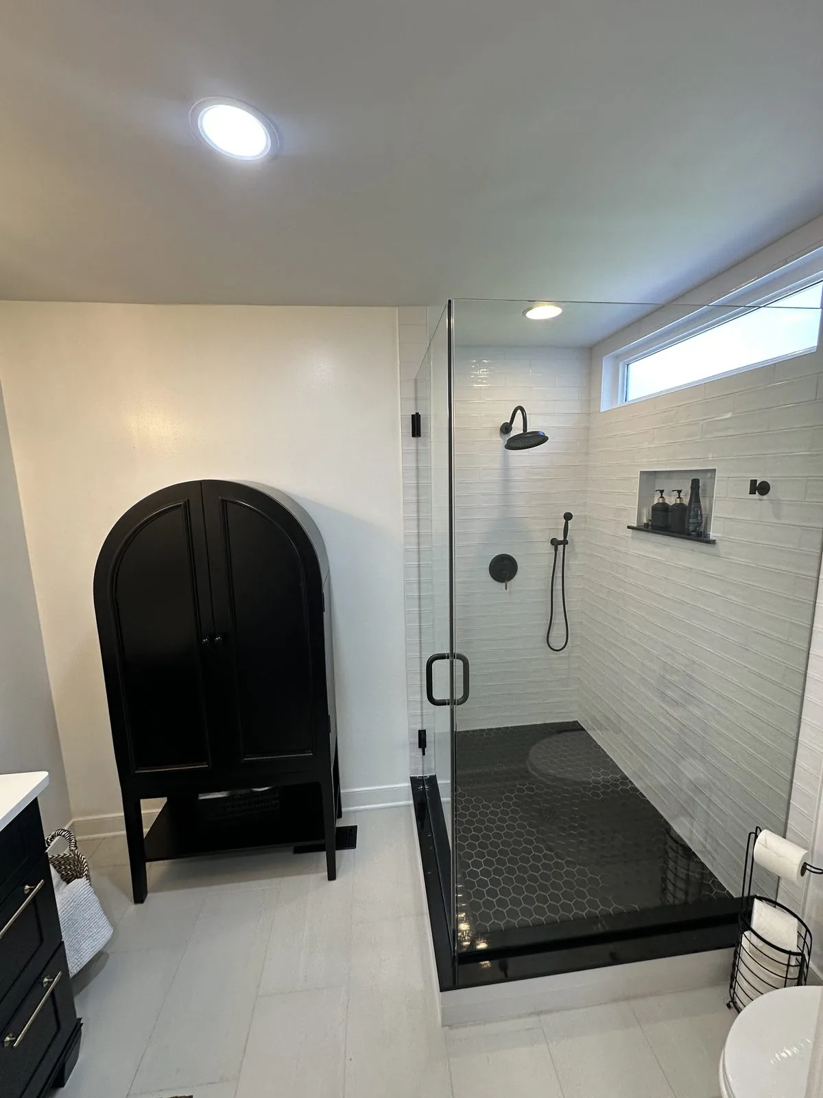 Custom tiled shower and updated fixtures in a remodeled bathroom. Cattail Road, Richmond, VA