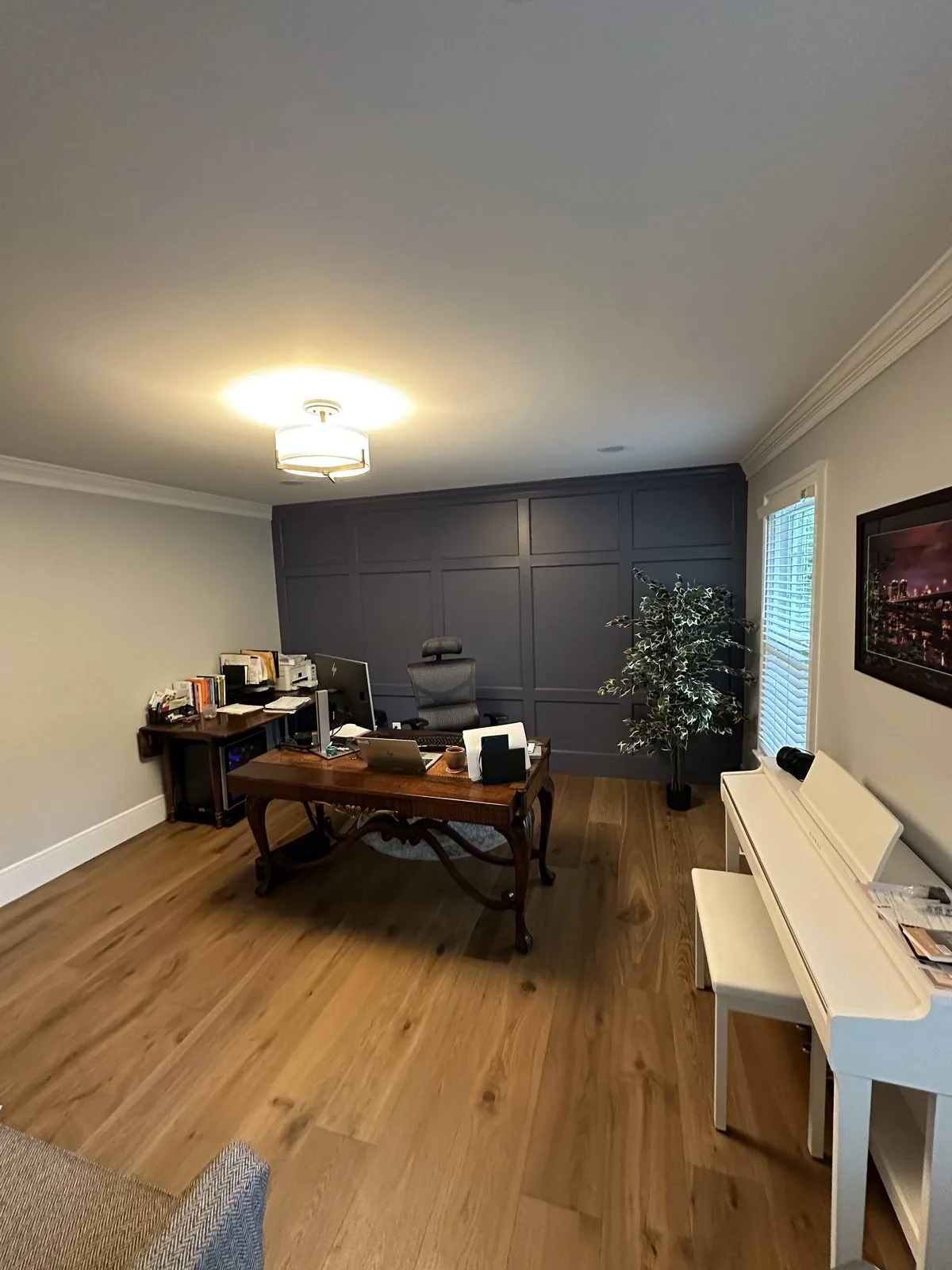 Finished home office with panel molding accent wall and new hardwood flooring. Grangewood, Richmond, VA