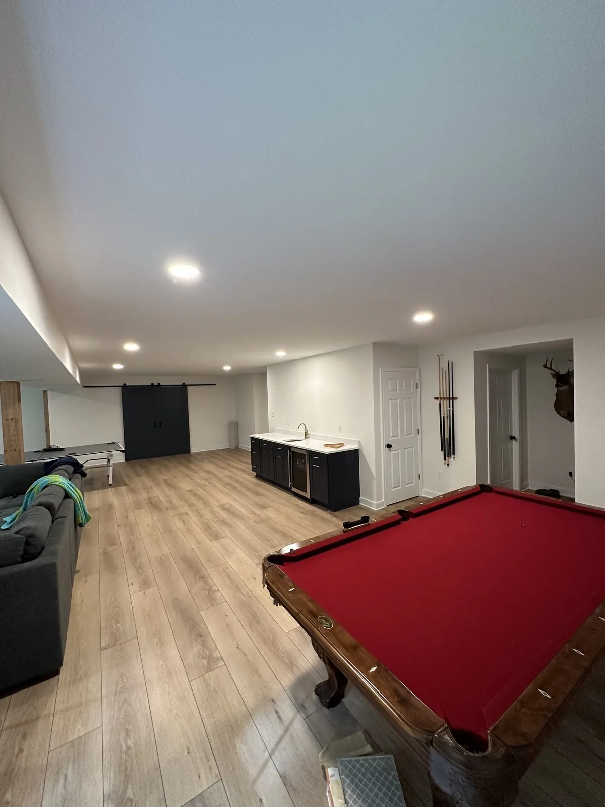 Finished basement rec room with wet bar, pool table, and new flooring. Lake Summer Mews, Richmond, VA