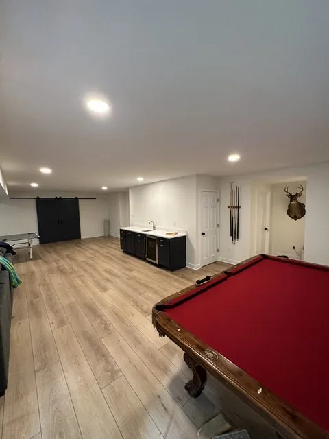 Finished basement with new flooring, lighting, and living space. Lake Summer Mews, Richmond, VA