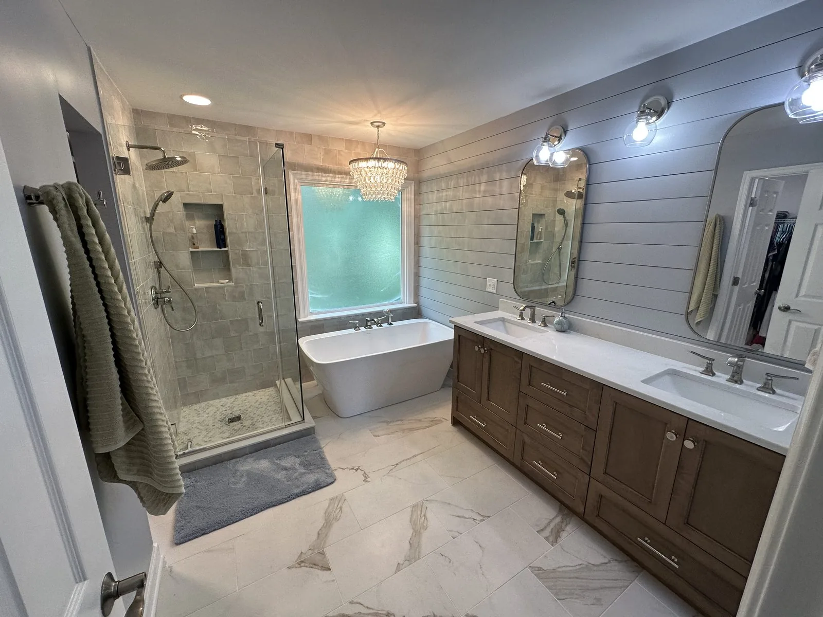 Remodeled bathroom with walk-in tiled shower and new vanity. South Shore, Richmond, VA