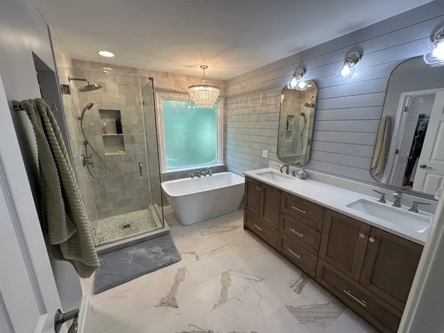 Remodeled bathroom with walk-in tiled shower and new vanity. South Shore, Richmond, VA