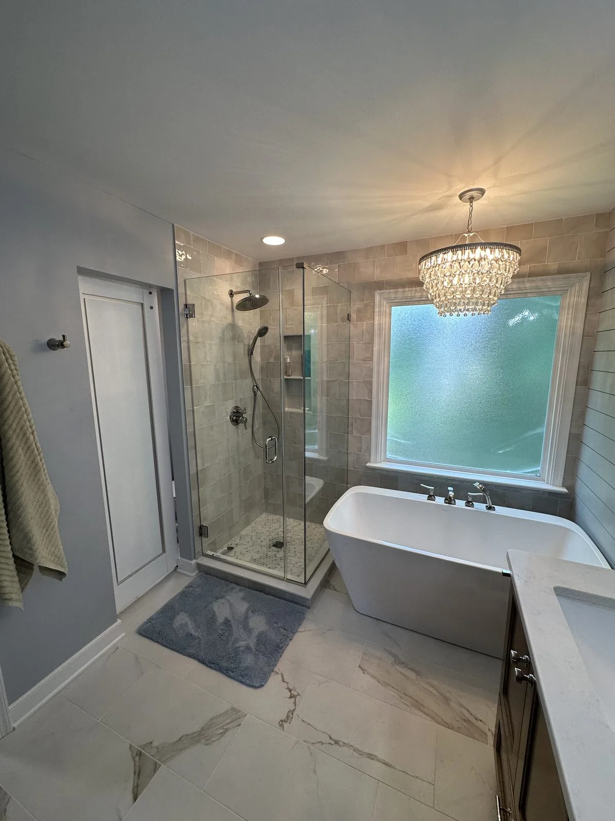 Updated vanity, lighting, and fixtures in a remodeled bathroom. South Shore, Richmond, VA